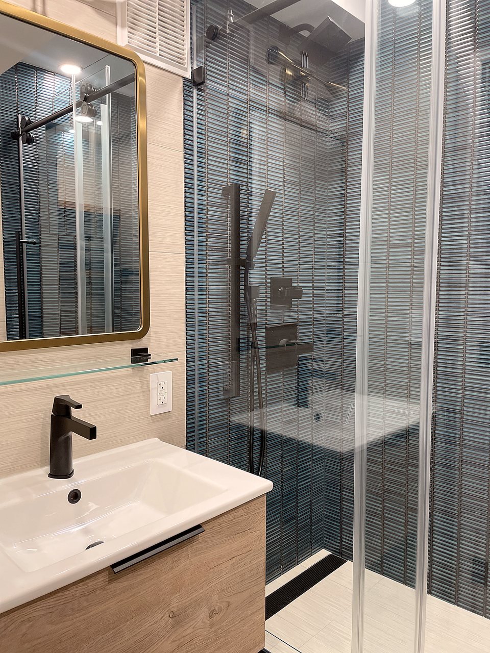 Vanity with sculptural mirror and sconces
