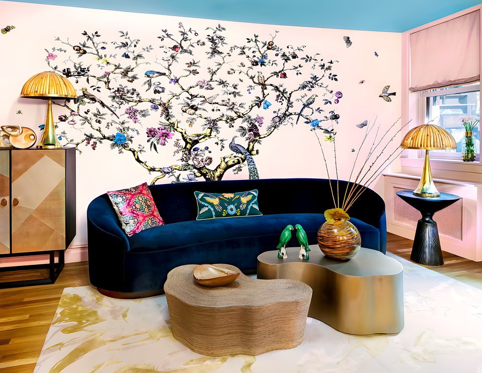 A pink sitting room with brass mushroom lamps at the Brooklyn Heights Designer Showhouse