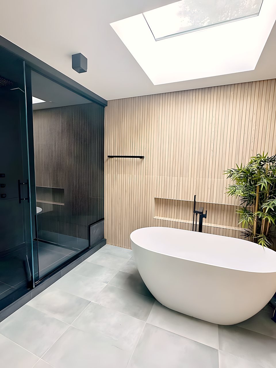 Primary bathroom with marble surfaces and warm metal fixtures