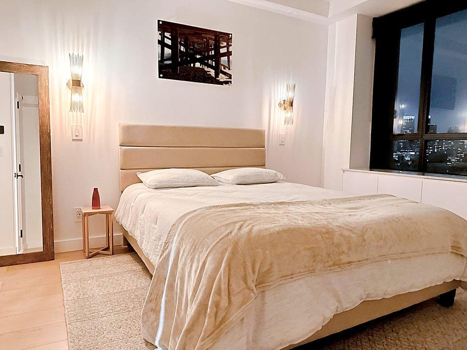 Adjoining bedroom with warm, layered tones