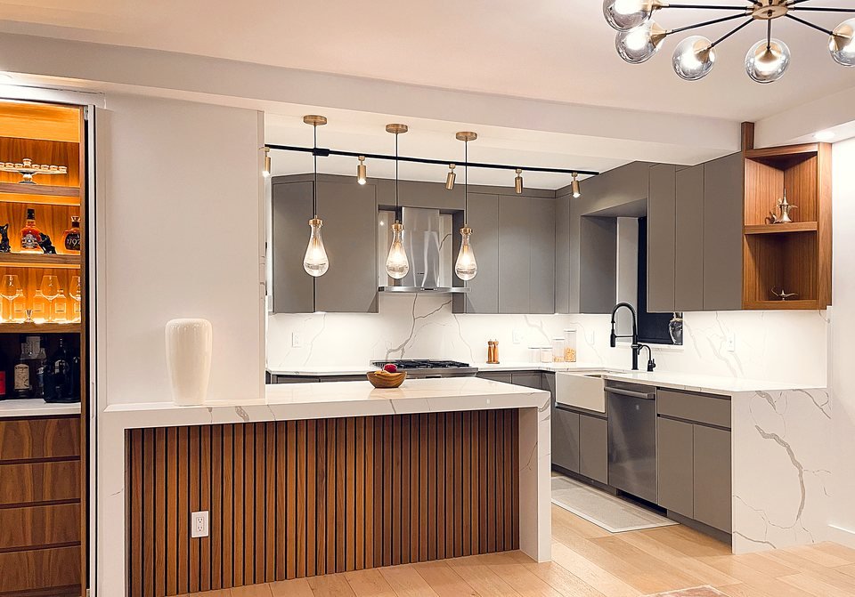 Kitchen view with brass fixtures and statement pendant lighting over the island