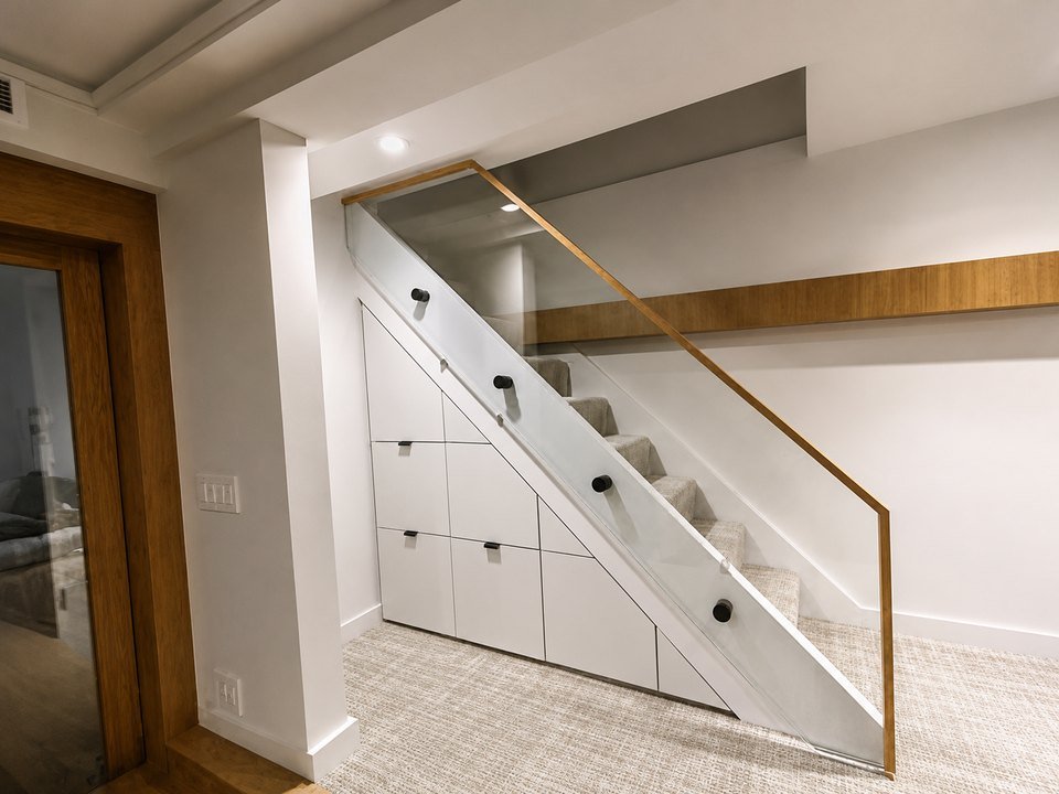 A staircase with integrated under-stair storage drawers